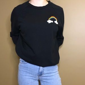 black sweatshirt with rainbow